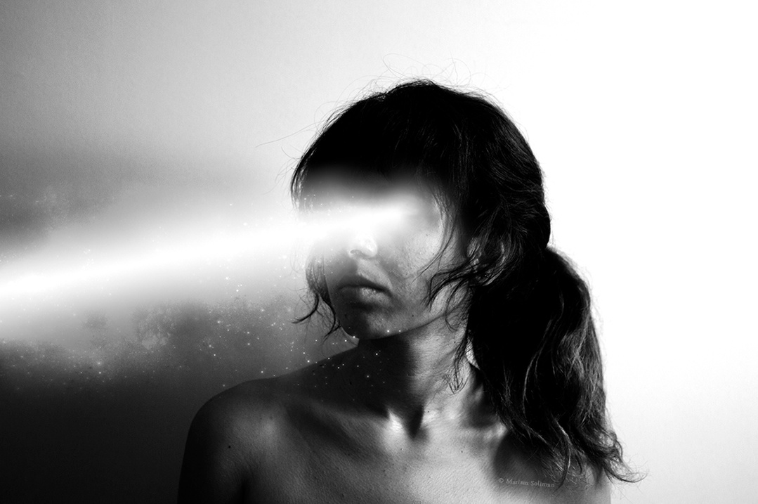 Dreamy and surreal black and white self portrait by young woman