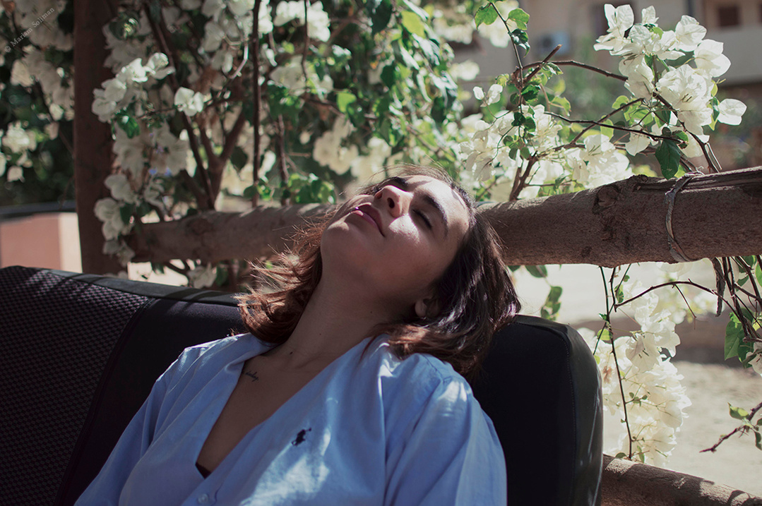 Travel Portrait of Relaxed Young Woman in Fayoum, Egypt