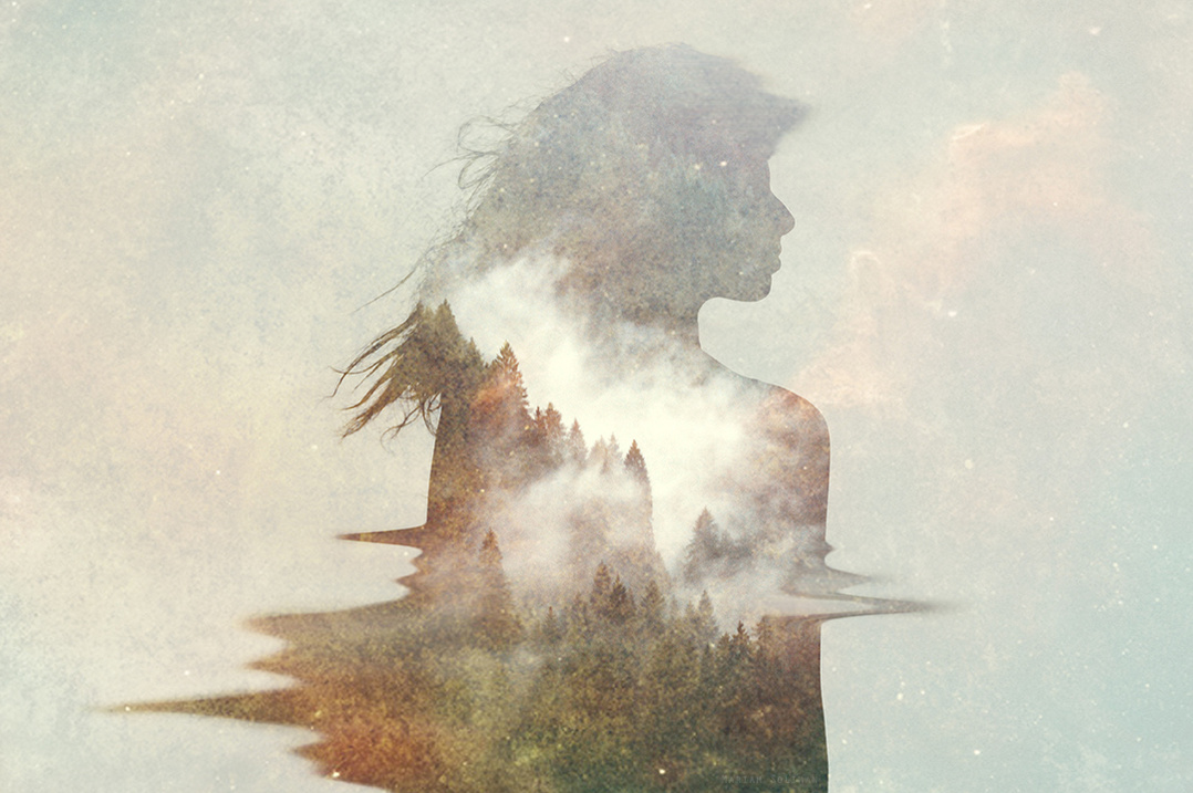 Conceptual dreamy collage of young woman with mountains and clouds 