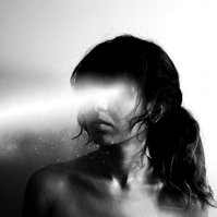 Dreamy and surreal black and white self portrait by young woman