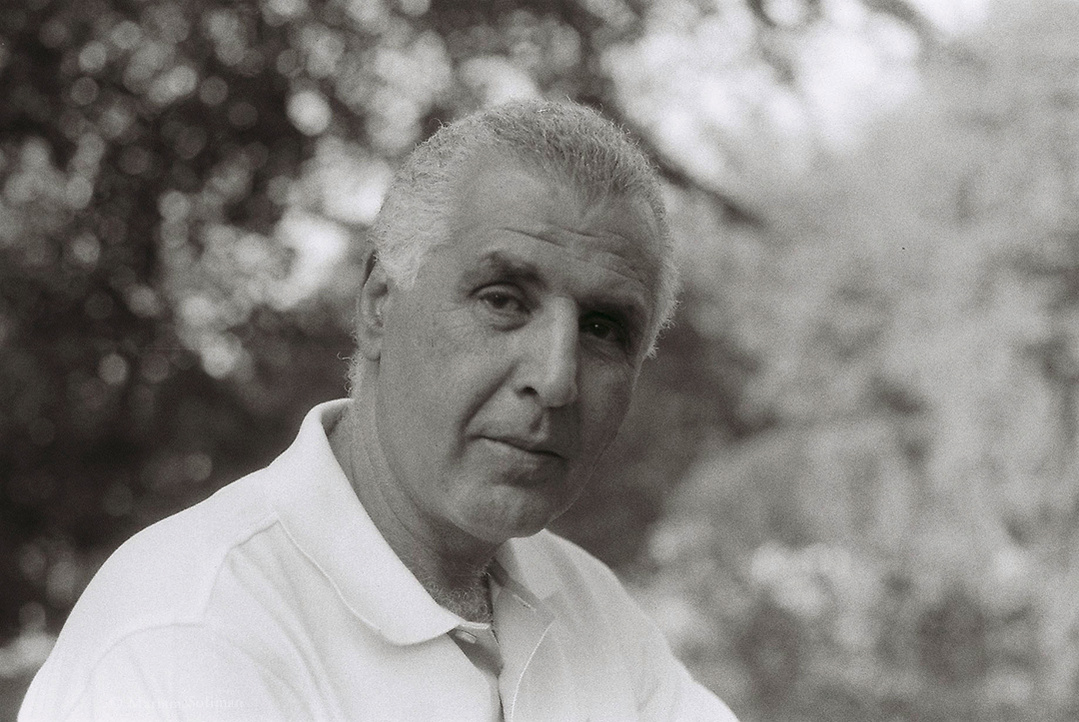 Black and white analog portrait of man in nature with bokeh
