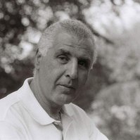Black and white analog portrait of man in nature with bokeh