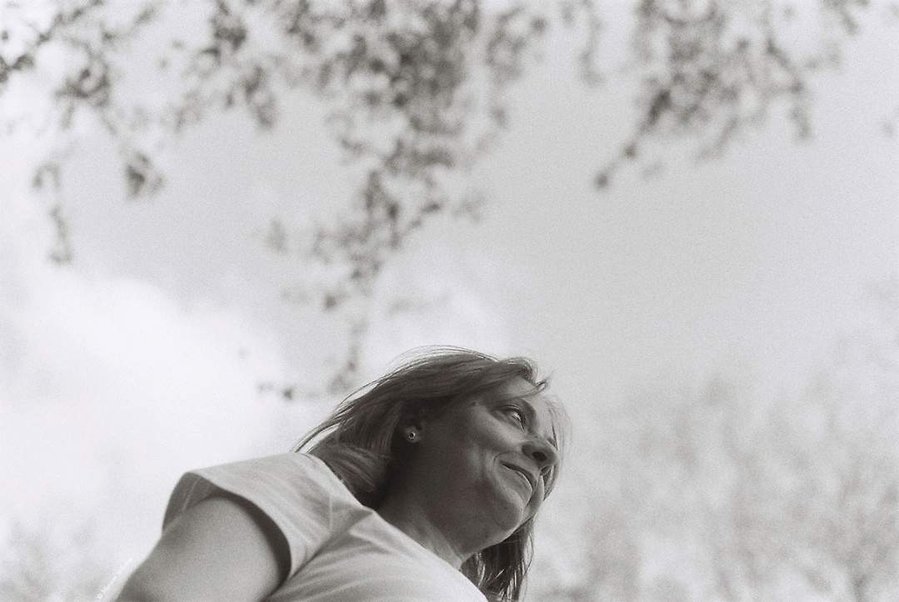 Black and white analog portrait of woman in nature