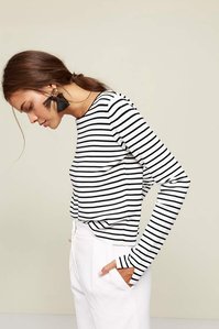 photo model in striped t-shirt on plain background