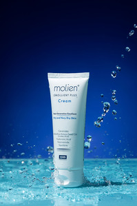 cosmetic skin cream product on blue turquoise background with water splash