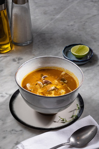 Asian-Style Seafood Soup on marble table