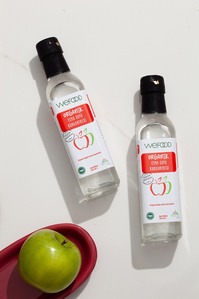 organic apple concentrate bottles with green apple