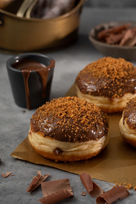 berliner on table with a glass of hot chocolate  
