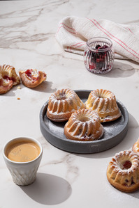 pastry and coffee with milk on marble 
