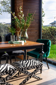 interior with wooden dining table and green chairs