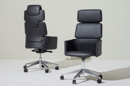 2 leather office chairs on plain background