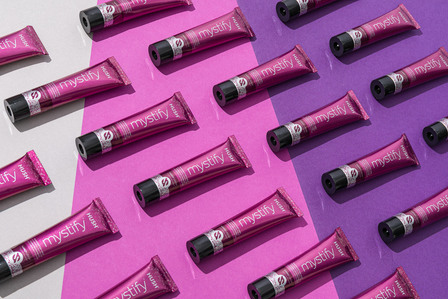hair color product packages on pink purple background