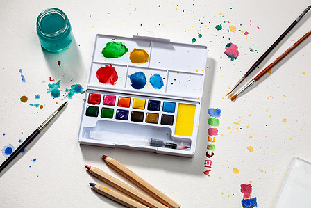 water-colour with brushes and pencils