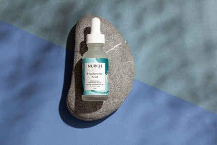 cosmetic product bottle on stone