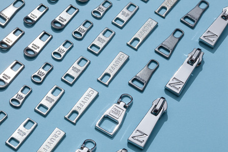 zippers on blue plain background