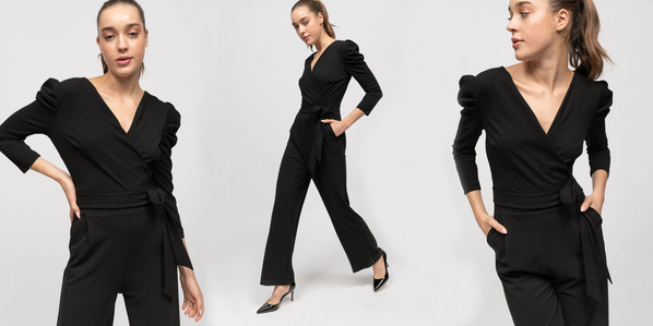 photo model with black jump suit on plain white background