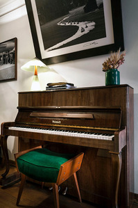piano with chair photo print on wall