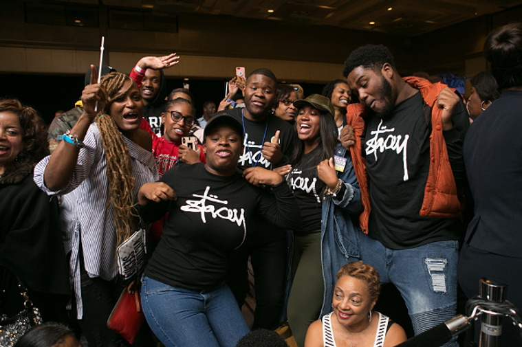 Supporters gather on Election Night wearing campaign t-shirts