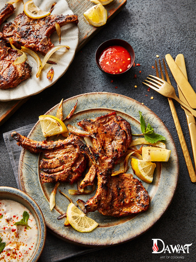 Lamb chops shot in a editorial style on dark background, perfect for editorial and restaurant food photography, shot by food photographer, Sid Ali
