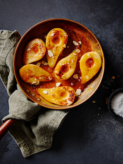 Poached pears in a pan with salt to season, perfect for editorial, advertising and restaurant food photography, shot by food photographer, Sid Ali