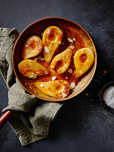 Poached pears in a pan with salt to season, perfect for editorial, advertising and restaurant food photography, shot by food photographer, Sid Ali