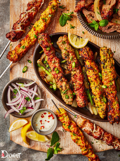 A selection of grilled kebabs on a wooden chopping board , perfect for editorial, advertising and restaurant food photography, shot by food photographer, Sid Ali