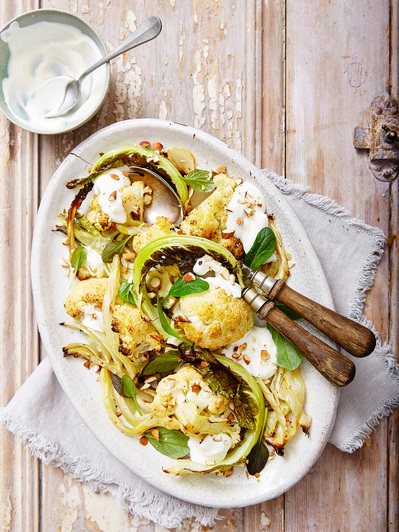 A cauliflower salad with yoghurt sauce, perfect for editorial and restaurant food photography, shot by food photographer, Sid Ali