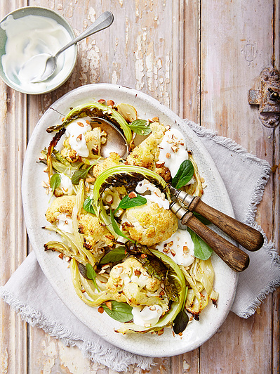 A cauliflower salad with yoghurt sauce, perfect for editorial and restaurant food photography, shot by food photographer, Sid Ali