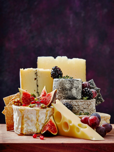 Oozing cheese arrangement. purple background, perfect for editorial, advertising and restaurant food photography, shot by food photographer, Sid Ali