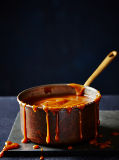 A rustic pan dripping with caramel, perfect for editorial, advertising and restaurant food photography, shot by food photographer, Sid Ali