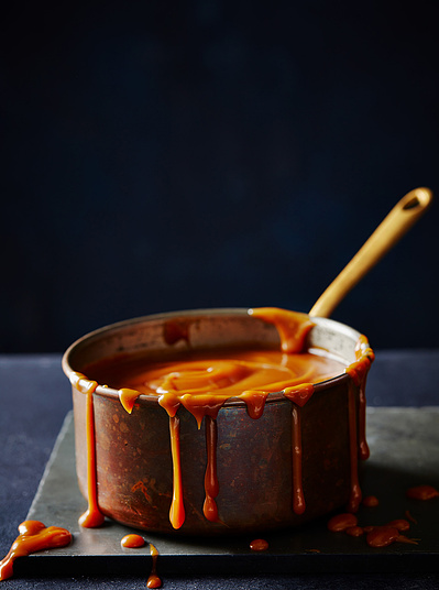 A rustic pan dripping with caramel, perfect for editorial, advertising and restaurant food photography, shot by food photographer, Sid Ali