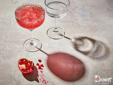 Summer drinks photography with a broken pomegranate segment, perfect for editorial, advertising and restaurant food photography, shot by food photographer, Sid Ali