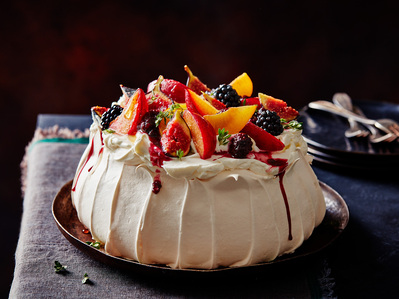 A dark and moody pavlova on a dining table setting, perfect for editorial, advertising and restaurant food photography, shot by food photographer, Sid Ali