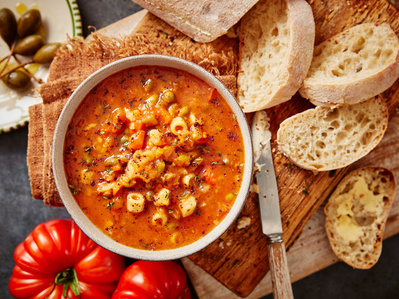 An editrial soup shot with sourdough bread, tomatoes and olives, perfect for editorial, advertising and restaurant food photography, shot by food photographer, Sid Ali