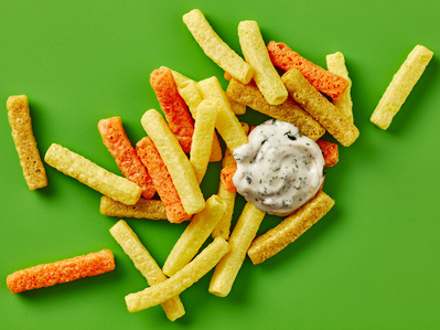 A graphic chips and dip photography shot on bright green background, perfect for editorial, advertising and restaurant food photography, shot by food photographer, Sid Ali
