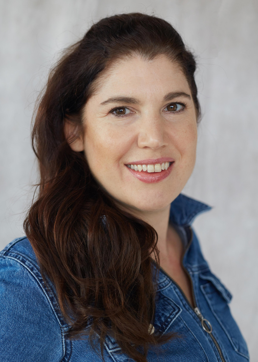 Personal Branding image of a woman with denim dress against a studio background
