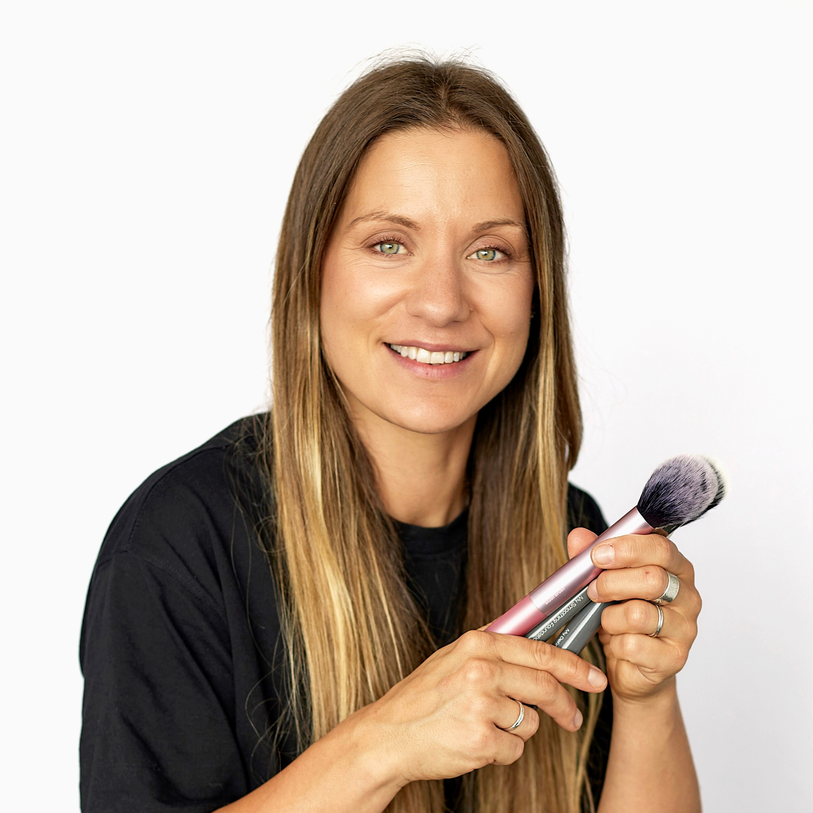 personal branding photo of makeup artist in studio against a white background 