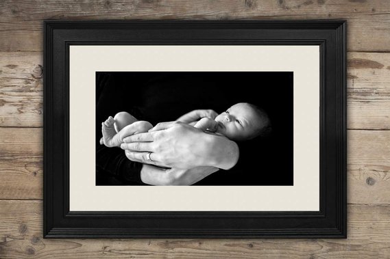 Picture of wall art - fine art floating frame with a newborn baby held by Dad