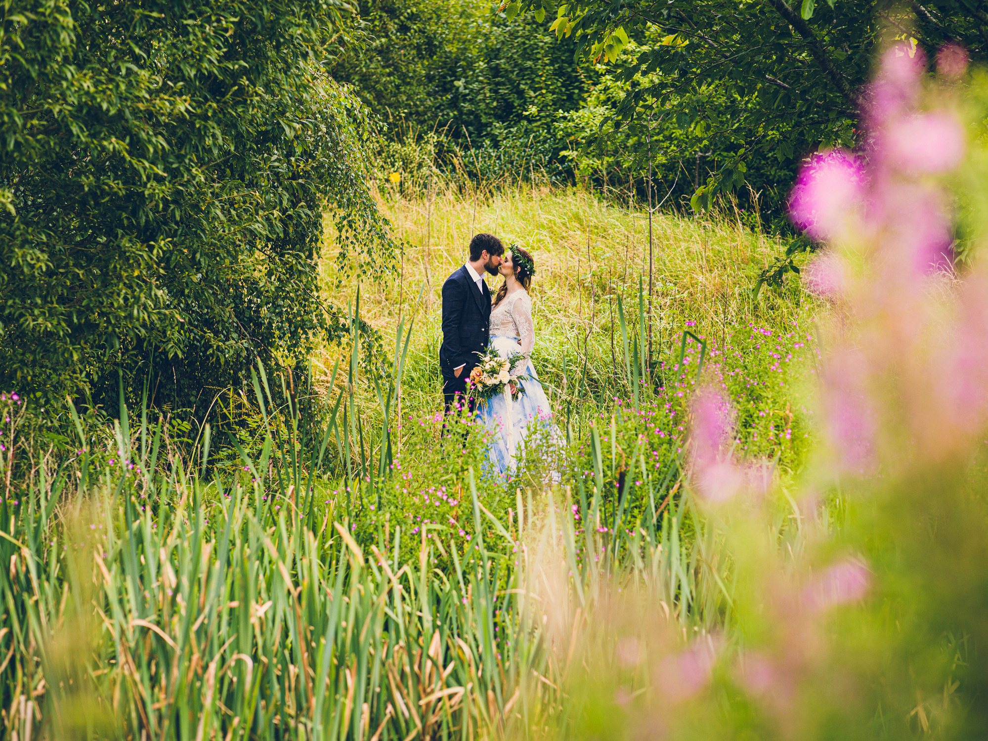 Sandry Studio Photographers contact page photo. Professional wedding commercial and portrait photographers near Worcester UK Photo of couple by pond at Oldcastle venue Malvern