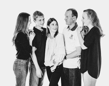 Wedding Photograph of couplFun family portrait in the studio by Robin Sandry of Sandry Studio Worcester UK professional photographer taken in black and white. Relaxed. Fun.