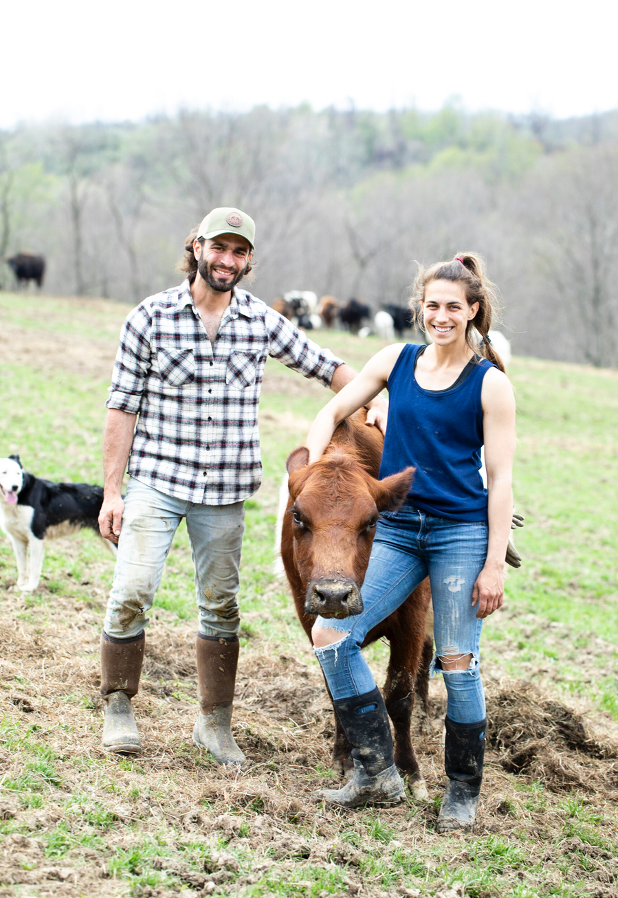 Lifestyle branding photography for Pittsburgh beef and pork farm. Male and female farmer in work clothes with a brown cow. 