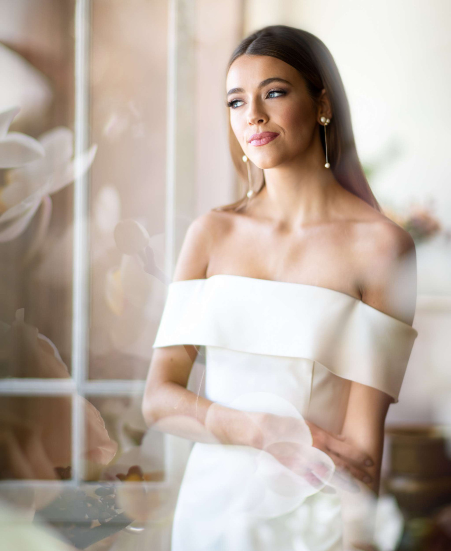 Editorial photography of bride in white dress with floral overlay. 