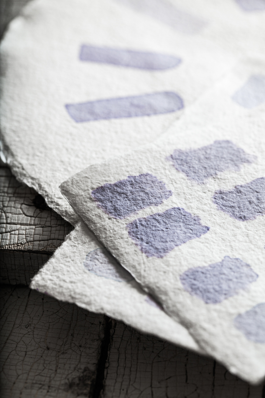Blue cabbage dye samples on natural watercolor paper for dyed egg photography