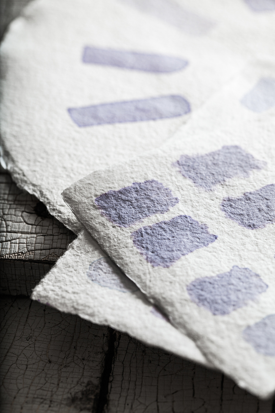 Blue cabbage dye samples on natural watercolor paper for dyed egg photography