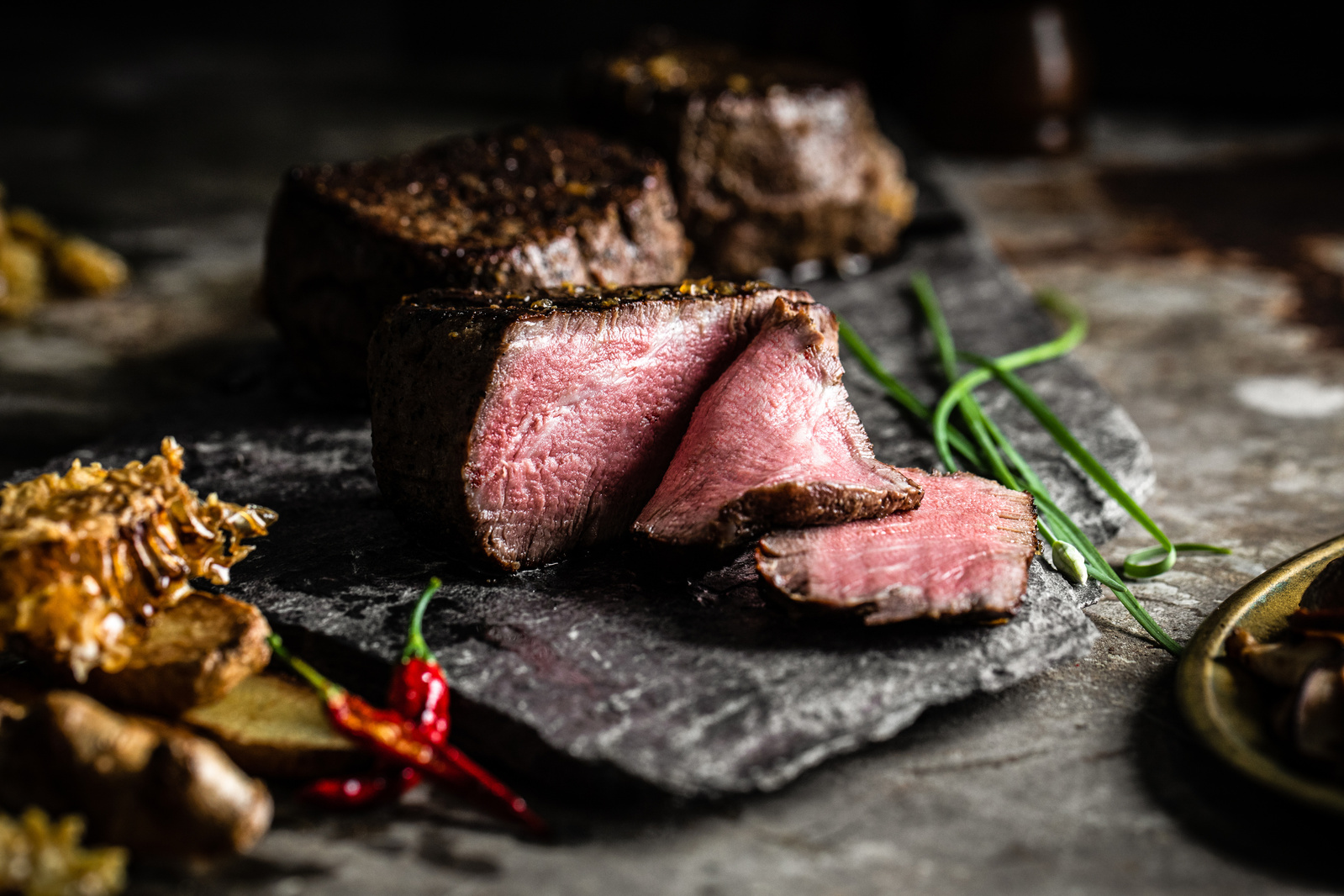 A mouth-watering meat photography image featuring a delicious picture of steak from a premium meat company. The food photography showcases a perfectly cooked steak, with a golden-brown sear on the outside and a juicy pink center. 
