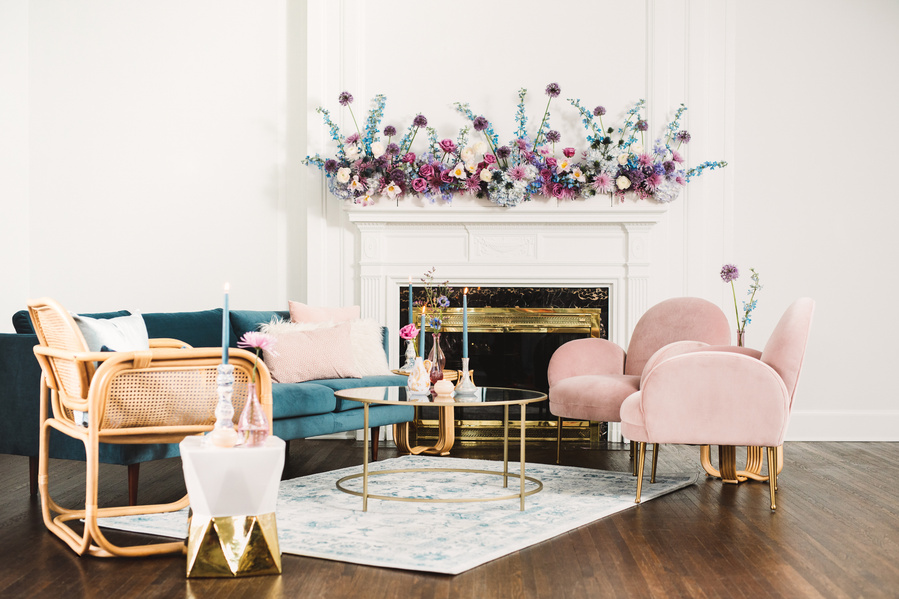 The sitting room set of a Bridgeton tea party. The overall effect is charming and feminine, with a touch of vintage flair. This image is perfect for inspiring ideas for a bridal shower, tea party, or any elegant occasion that calls for cute desserts.