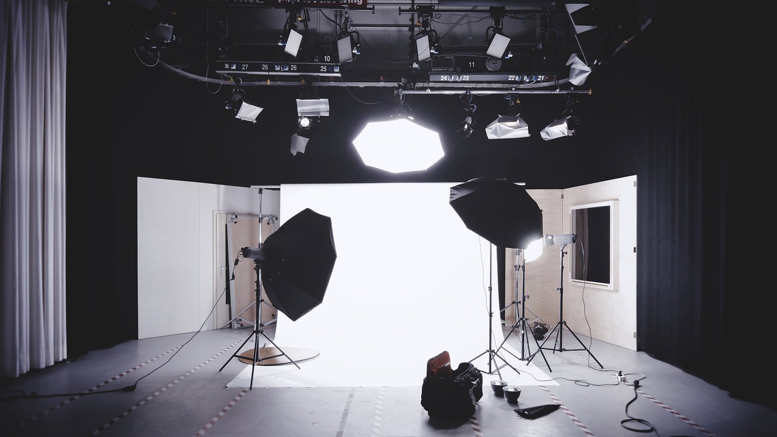 Behind the scenes shot of a studio shoot. Studio lighting seen for a portrait shoot.
