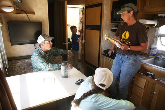 Chris and Mike caught up on some paperwork and talked about what needed to be taken care of for the day while Ben checked his hair in the mirror. Chris went back to the morning’s starting spot to retrieve the trailer and catch it up with the sheep.