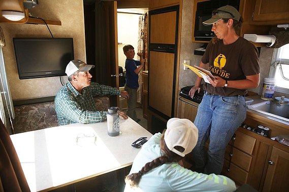 Chris and Mike caught up on some paperwork and talked about what needed to be taken care of for the day while Ben checked his hair in the mirror. Chris went back to the morning’s starting spot to retrieve the trailer and catch it up with the sheep.