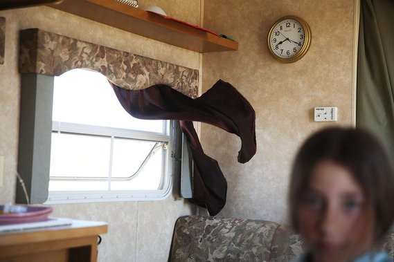 After settling in for the day to avoid the heat, the hot wind began howling, sending curtains and loose papers flying as the open windows and doors attempted to cool off the space. The stuck clock on the wall reminded no one of the time.